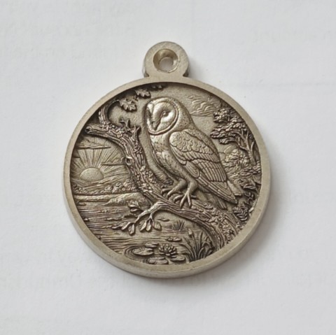 Owl on branch above a pond sterling silver pendant