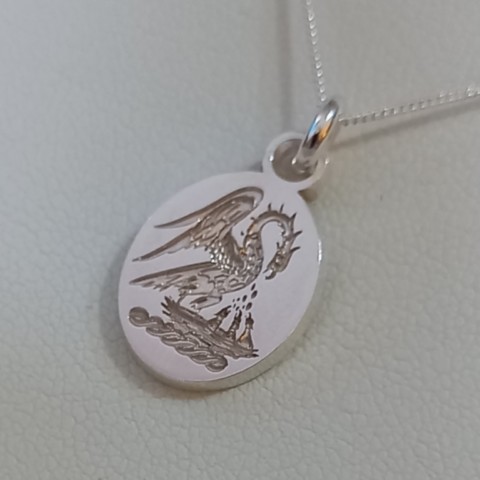 Any family crest seal style engraved to order into silver pendants in England